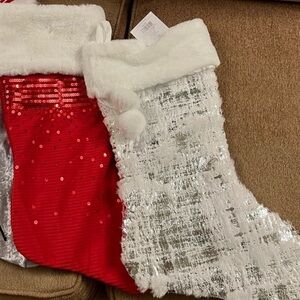 2 red and silver christmas stockings
